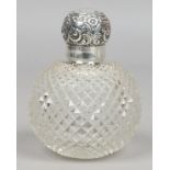 A Victorian cut glass globular scent bottle with silver top, assayed Birmingham 1892.