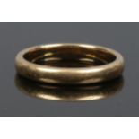 A 9ct gold band, size J, 2.2 grams.