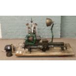 An engineers belt driven lathe in need of restoration with additional electric motor.