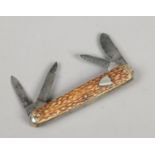 A multi tool folding pocket knife by George Wostenholm Sheffield with antler scales having shield