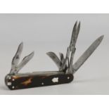 A 19th century multi tool folding pocket knife with tortoise shell scales, 11 accoutrements.