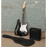 A cased elevation six string electric guitar and Clarity 20w amplifier.
