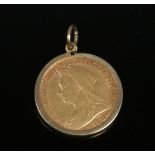 A Victorian 22ct gold half sovereign 1898 in a 9ct gold mount, gross weight 4.95 grams.