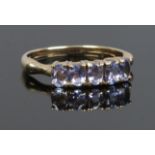 A 9ct gold five stone tanzanite ring. Size N.