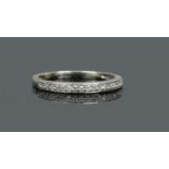 A 9ct white gold and diamond half eternity ring, size Q1/2.