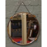 An oak framed bevel edge Art Deco wall mirror.