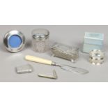 Seven assorted silver items; vesta case, fruit knife, serviette ring, small photograph frame,