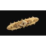 A 9ct gold bar brooch set with seed pearls and a ruby, 2.7 grams gross.