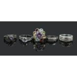 Five silver dress rings including white paste and multi gem set example.