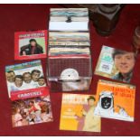 A quantity of 7 inch singles including John Lennon, Elvis Presley, Wings,