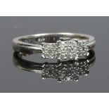 A 9ct white gold ring with 27 diamonds on a stepped setting, 0.25ct total. Size M 1/2.