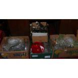 Four boxes of mixed glassware and metalware to include candelabra decorative vases,