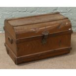 A painted vintage tin trunk with key.