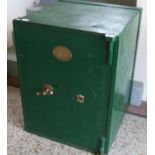 A Victorian green painted cast iron safe by T. Withers & Son West Bromwich with key.