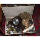 A vintage suitcase and contents to include oak mantle clock, metalwares etc.