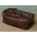 A large Victorian Gladstone type leather travelling case.