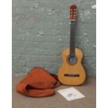 A Spanish acoustic guitar in case.