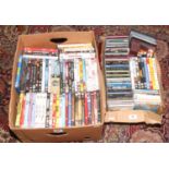 Two boxes of C.D and D.V.Ds mostly pop music, action, comedy and T.V series.