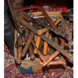 A box of tools to include large wrenches, spanners, hedge cutters, saws etc.