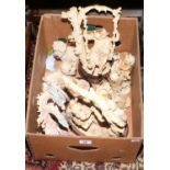 A box of decorative figures and ornaments including The Leonardo Collection examples.