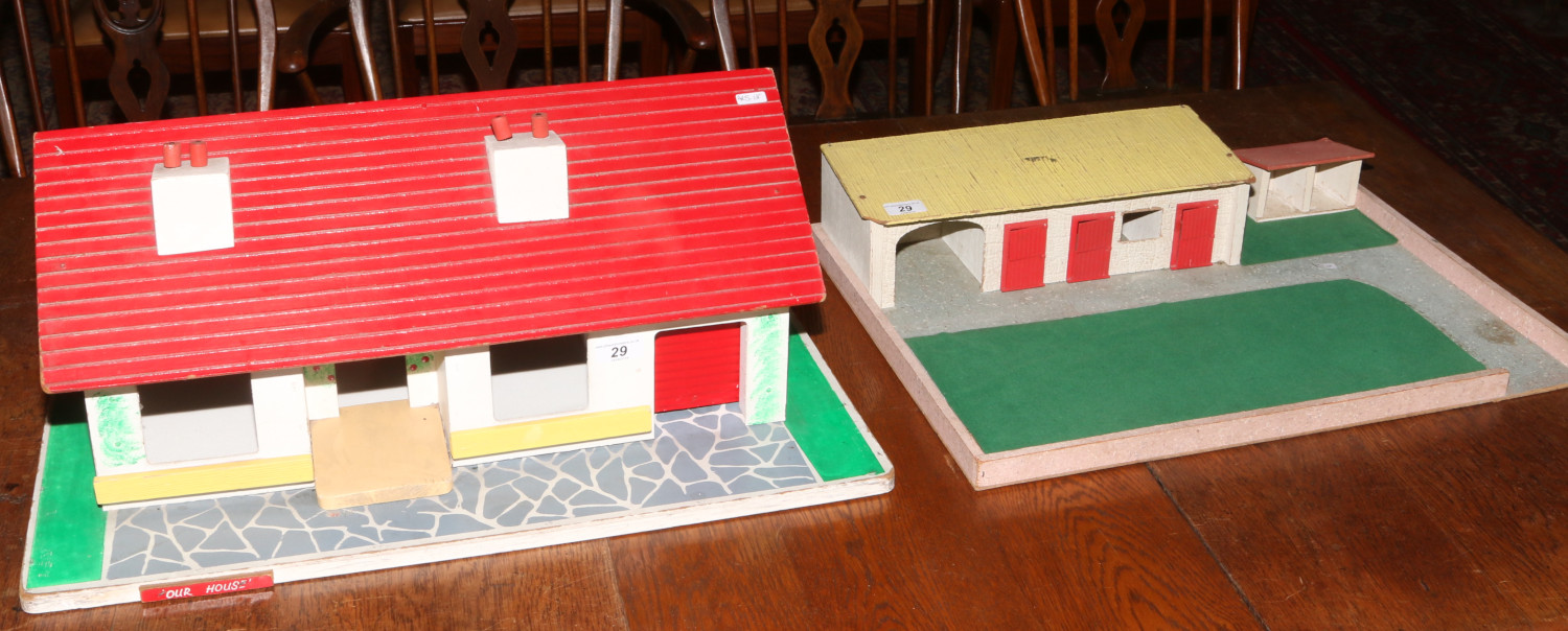 A dolls house bungalow with stables and paddock.