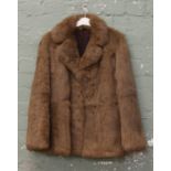 A ladies rabbit skin fur coat.