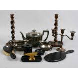 A collection of metal and wooden items to include silver plate teaset, ebony dressing table set,