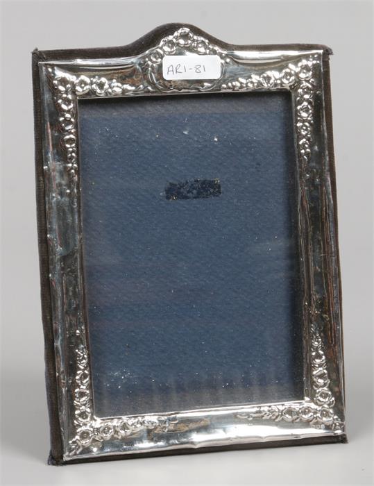 An ornate silver photograph frame assayed London 1981, by Reyford Frames Limited.