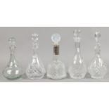 Five decanters including three cut glass examples.