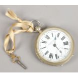 A silver plated pocket watch with white enamel dial Roman numeral markers and subsidiary seconds,
