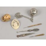 A small group of collectables to include silver, bone brooch, netsuke etc.