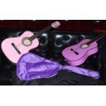 A painted falcon acoustic guitar along with a similar Martin Smith example and two carry bags.