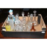 A box of glass and ceramic decanters.