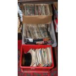 Three boxes of single records to include The Rolling Stones, Elvis Presley, ABBA etc.