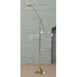 A brass effect anglepoise standard lamp.
