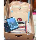 A carry case of 7 inch singles, along with a quantity of 78rpm records.