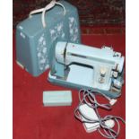 An electric powered Jones Fantasy 1 sewing machine and accessories.