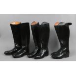 Two pairs of ladies black leather riding boots size 7, along with a pair of gentleman's size 10.5 by