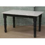 A part painted marble top table raised on turned legs.