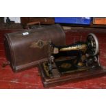 An oak cased dome top Singer sewing machine.