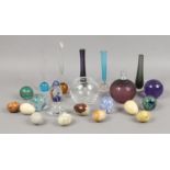 A quantity of collectable glass including paperweights along with several carved hardstone eggs.