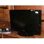 A Samsung 23 inch Syncmaster DTV monitor / television with remote control and booklet.