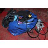 A collection of diving equipment single bottle cradle regulators, vests, snorkel, decompression