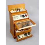 A multi compartment wooden jewellery box and contents of costume jewellery including necklaces,