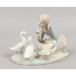 A bisque Lladro figure feeding the ducks.