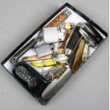 A box of folding pocket knives and lighters including Ronson etc.