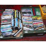 Two boxes of DVD's and PC C.D roms including action and comedy and T.V box sets.