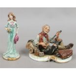 A Capodimonte style figure of a tramp along with a Capodimonte figure of a lady.