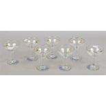 A set of seven Babycham glasses.