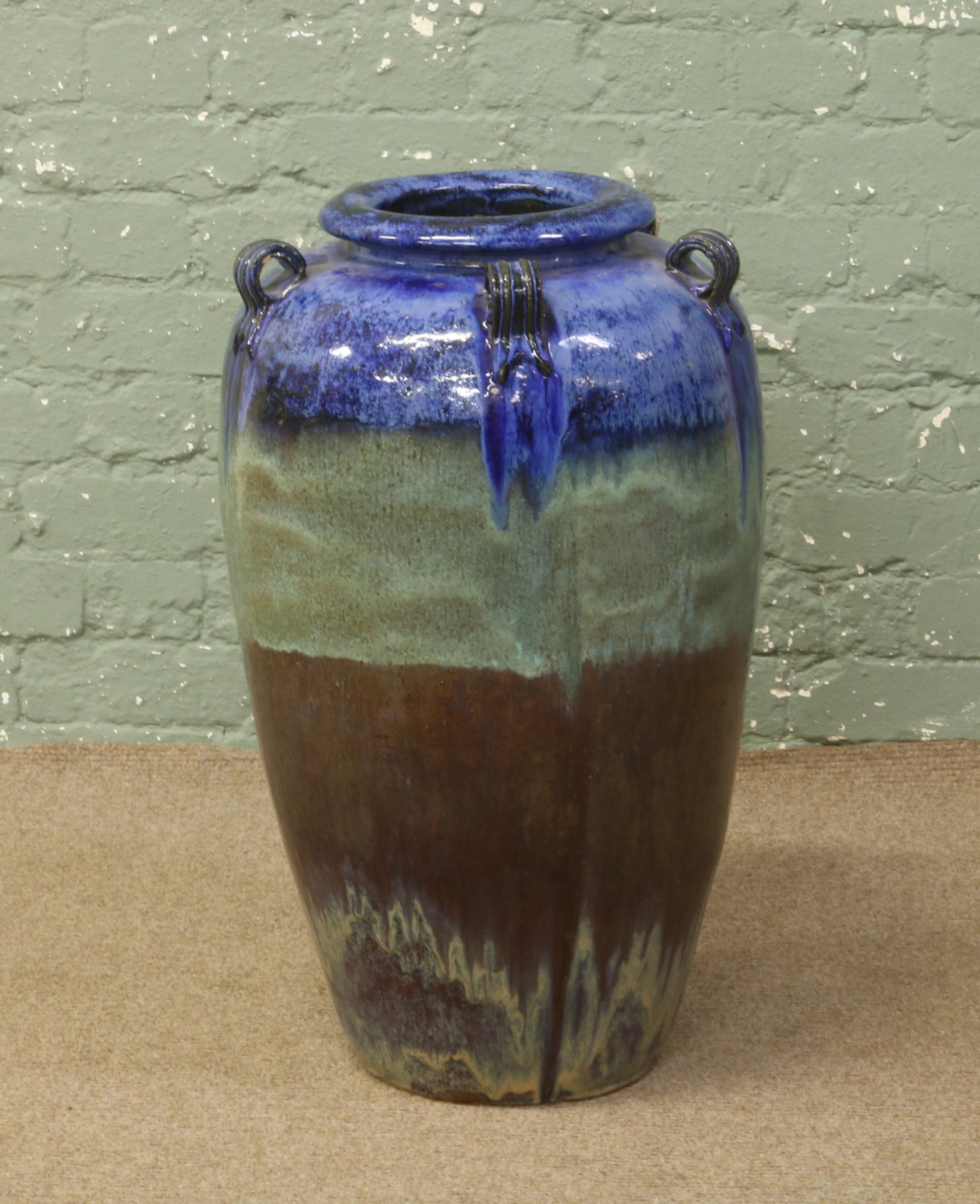 A large glazed terracotta floor standing vase, height 72cm.